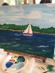 Finished watercolor of a sailboat in the bay under a cloudy sky